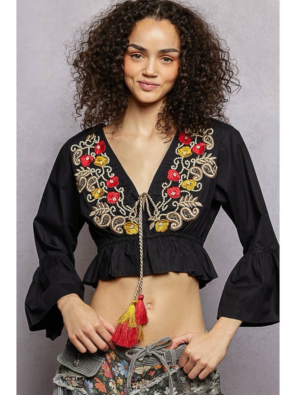 POL Embroidered Black V-Neck Peplum Top with Tassels